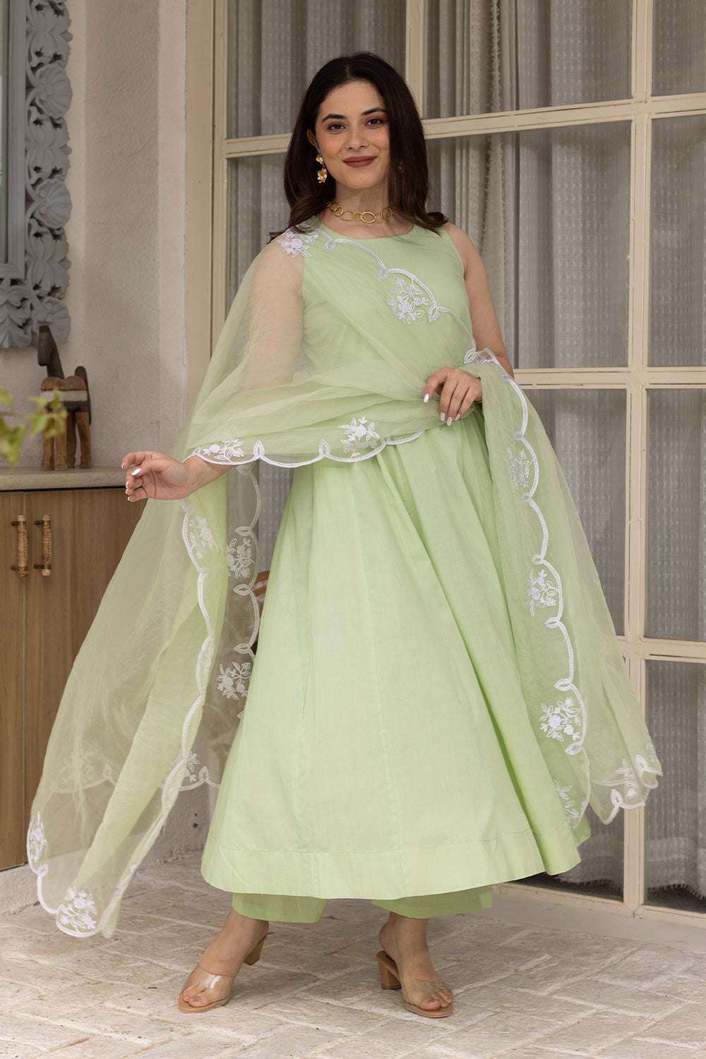 Pista cotton anarkali with an embroidered organza dupatta