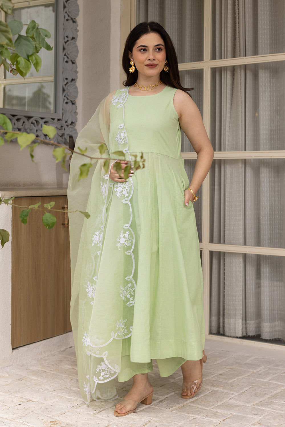 Pista cotton anarkali with an embroidered organza dupatta