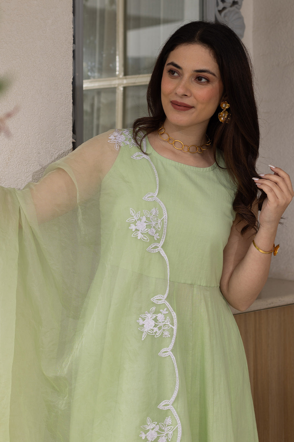 Pista cotton anarkali with an embroidered organza dupatta